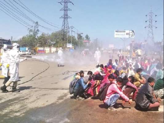 COVID19: Migrant workers sprayed with disinfectant to fight Coronavirus in Bareilly UP